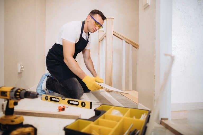 Maintenance man fixing a new floor