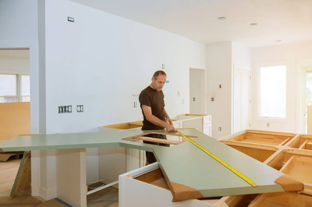 Installing laminate kitchen counter top a kitchen remodel.